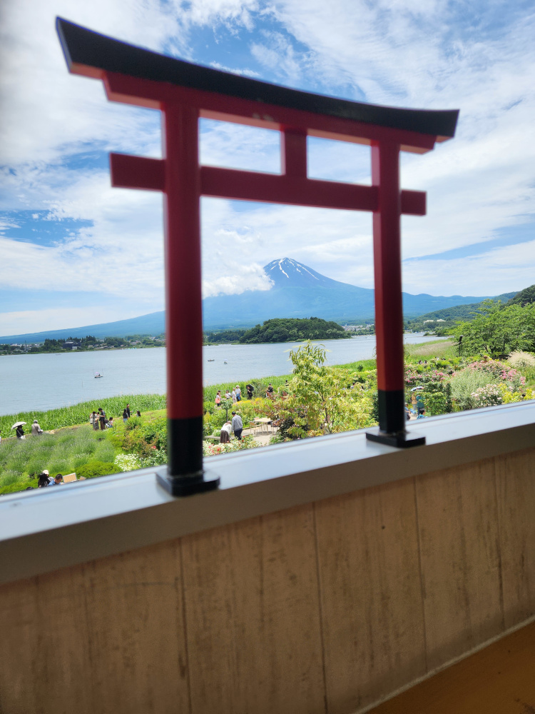 Mount Fuji as viewed through a miniature torii gate